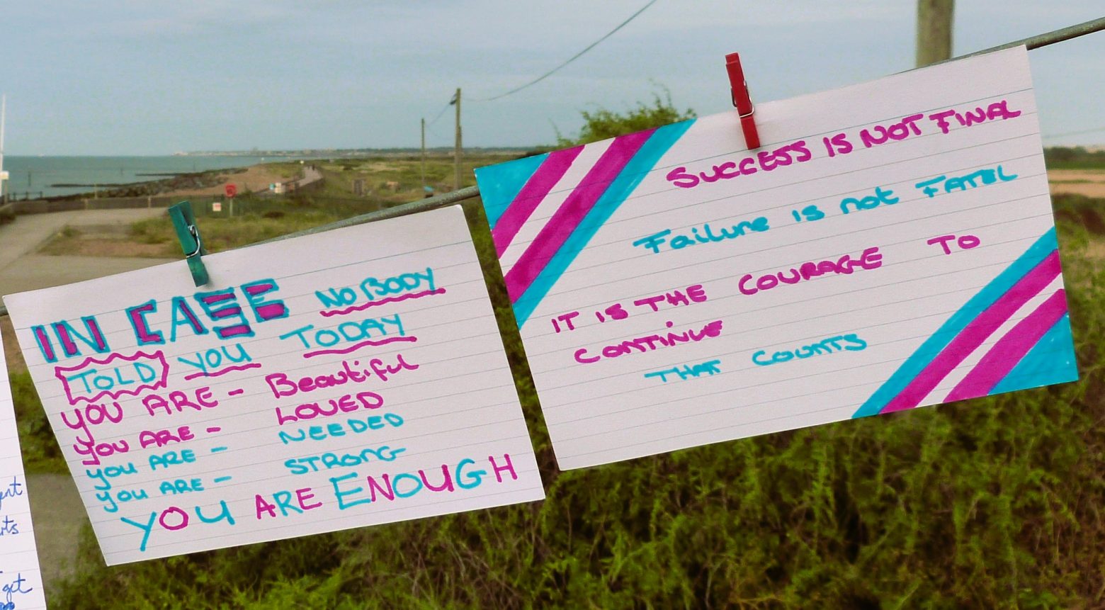 postcards that read "In case nobody told you today, you are beautiful, you are needed, you are strong, you are enough" and "Success is not final, failure is not final, it is the courage to continue that counts"